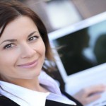 Beautiful business woman with laptop.
