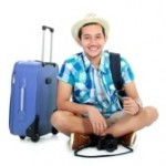 16116761-smiling-happy-tourist-sitting-on-white-background